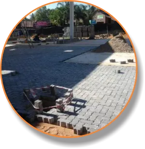 Brick paving being laid next to a kerb